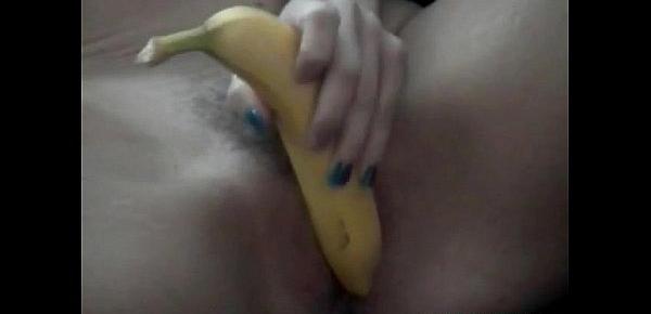  Naughty amateur blonde Julie removes clothes and teases pussy with banana